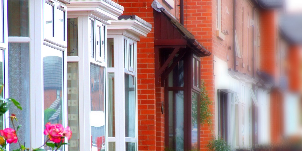 Diagonal view of the bay windows of a row of terraced houses